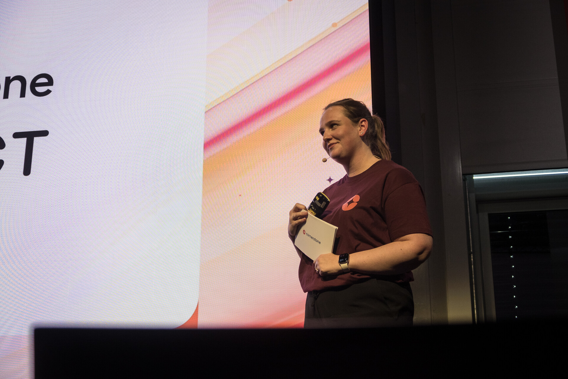 Hannah Whippey (Cornerstone) on stage between sessions.